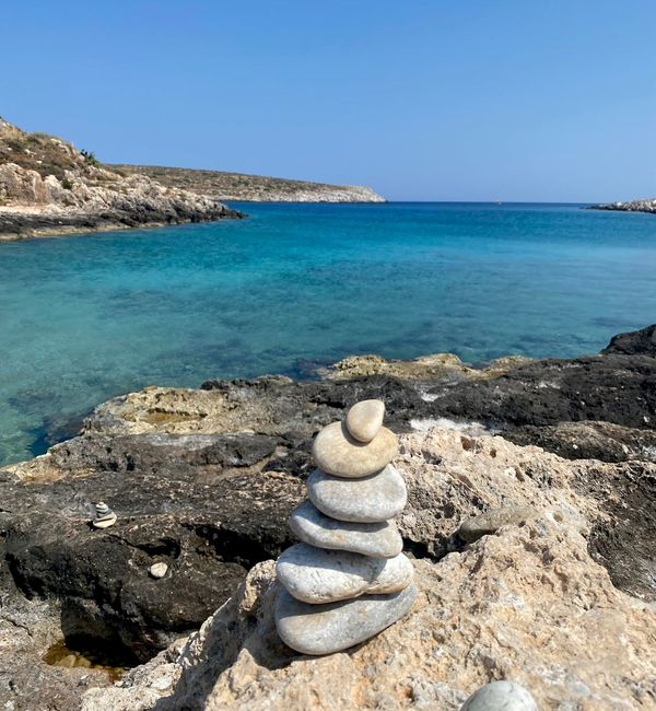 Symbol of balance, like stacked stones, in a serene environment.